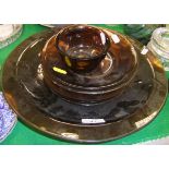 A collection of dark amber Pekin glass including small circular footed bowl,