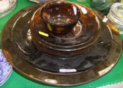 A collection of dark amber Pekin glass including small circular footed bowl,