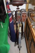 A collection of seven various shooting sticks, three parasols,