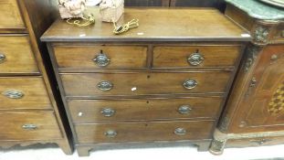 A 19th Century mahogany chest of two short and three long drawers with brass handles and
