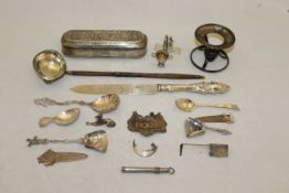 A box of assorted white metal and silver items,