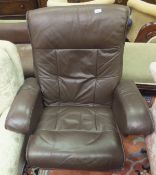 An Ekornes style stressless brown leather armchair and footstool
