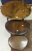 An Ercol circular mid elm coffee table,