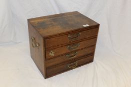 A circa 1900 oak table top chest of four drawers,