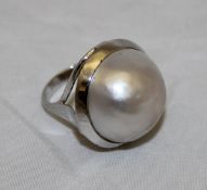 A silver mounted cultured pearl set dress ring approx 18mm diameter,