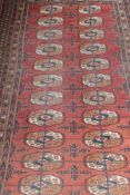 A Bokhara Tekke rug, the repeating elephant foot medallions in cream, cinnamon,