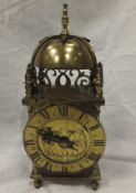 A 20th Century lacquered brass cased lantern clock in the 17th Century style CONDITION