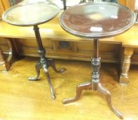 Two mahogany and inlaid tripod wine tables