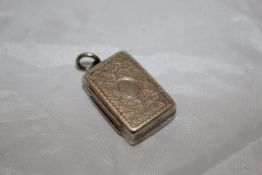 A Victorian silver vinaigrette with engraved decoration to front and back,