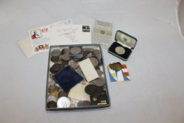 A box containing a collection of coinage to include a Roman Trajan 98-118 AD silver denarius coin,