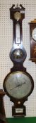 A 19th Century mahogany framed barometer thermometer with silvered dry/damp dial over a mercury