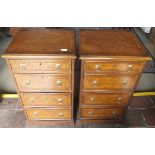 A pair of burr oak and crossbanded bedside chests of four drawers,