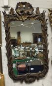 An 18th Century carved giltwood frame wall mirror with all over scrolling foliate and floral