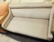 A late Victorian two seat sofa with low swept arms on turned front legs,