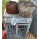 A wooden wheelbarrow, a galvanised metal animal cage with bottle holder,