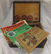 A Victorian mahogany and inlaid box containing a collection of vintage Meccano and instruction