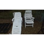 Two white plastic sun loungers,
