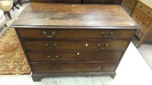 A Georgian mahogany chest of four long graduated drawers,