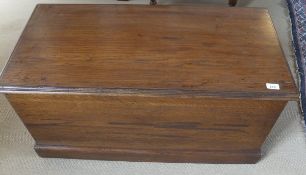 An oak chest with applied moulded edge, with brass carry handles, to plinth base, 94.5 cm x 46.