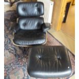 A black leather button back upholstered chair and ottoman in the manner of Charles and Ray Eames,