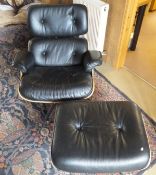 A black leather button back upholstered chair and ottoman in the manner of Charles and Ray Eames,