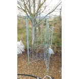 A three panel painted metal Gustav style folding screen with fleur de lys decoration *