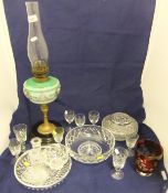 A collection of glassware to include a Victorian oil lamp with green glass bowl painted with