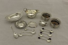 A box containing a collection of silver and plated ware, to include a silver sauceboat,