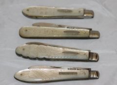 Four silver bladed mother of pearl handled folding fruit knives