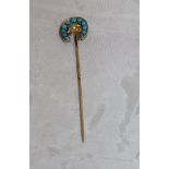 A 15 carat gold turquoise and seed pearl set stock pin in the form of a horseshoe