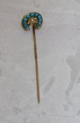 A 15 carat gold turquoise and seed pearl set stock pin in the form of a horseshoe