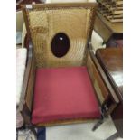 A Regency style mahogany framed and cane backed bergere armchair,