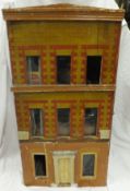 A vintage wooden doll's townhouse,