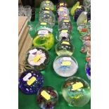 A collection of sixteen glass paperweights to include examples with bubble decoration,