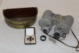 A pair of large grey painted military / naval binoculars,