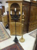 A wrought iron 3 branch standard lamp and a gilt decorated standard lamp