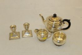 A George V silver three piece tea set with beaded edging,