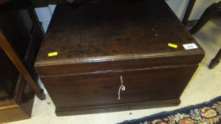 A mahogany chest of small proportions with iron handles and key,