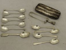 A box containing a set of six Elkington & Co silver spoons,