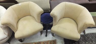 A pair of tub style armchairs in oatmeal patterned upholstery,