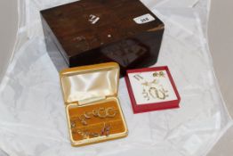 A mahogany box containing various 9 carat gold and other earrings, some set with stones, pearls,