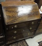 A Georgian mahogany bureau of three drawers with brass handles and plain mahogany fall,