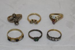 A collection of five 9 carat gold dress rings, each set with stones,
