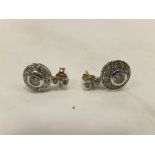 A pair of diamond set earring,