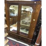 An Edwardian mahogany and inlaid double mirror door wardrobe with two drawers