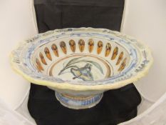 A 19th Century polychrome decorated Delft ware pedestal bowl of large proportions painted with a