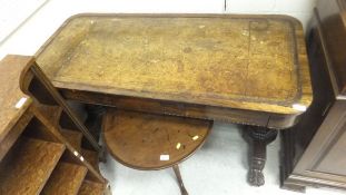 A William IV rosewood library table with tooled and gilded leather insert top above two freize