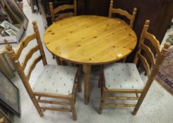 A modern circular pine table,