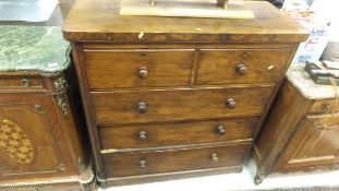 A Victorian walnut chest of two short and three long graduated drawers,