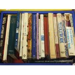 Two boxes of assorted hardback books relating to textiles, needleworks, alcohol,